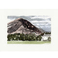 A watercolor landscape art print depicting a large dark mountain peak, green fields, trees, and a small white building under a cloudy sky, presented on a textured off-white paper background.