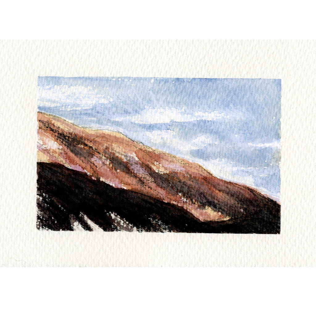 A watercolor landscape painting of a mountain slope under a blue sky, shown on a textured off-white paper background.