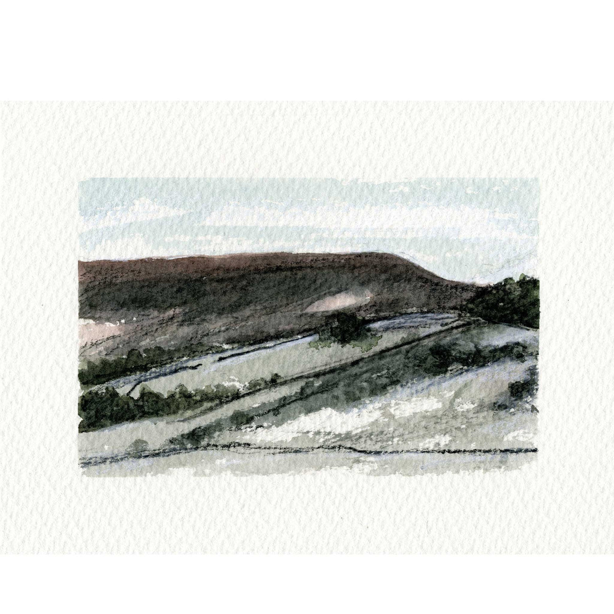 A watercolor landscape painting of rolling hills and fields, shown centered on a textured off-white paper background.