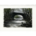 A watercolor painting of a dark stone bridge spanning a stream, surrounded by dense trees, presented on a textured off-white paper background.